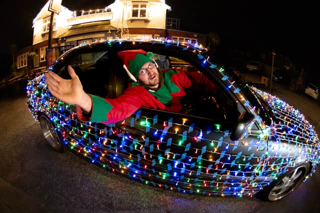 Steven Buck, from Leyland, is spreading Christmas cheer around his hometown with his BMW wrapped in fairy lights