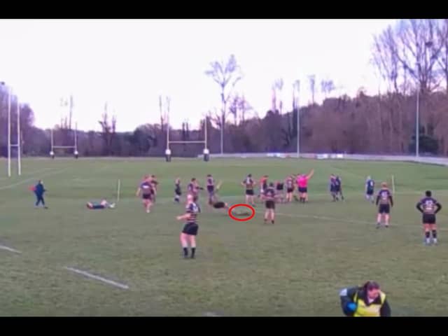 Video grab shows the moment a deer invaded a rugby pitch - and tackled a player. 
