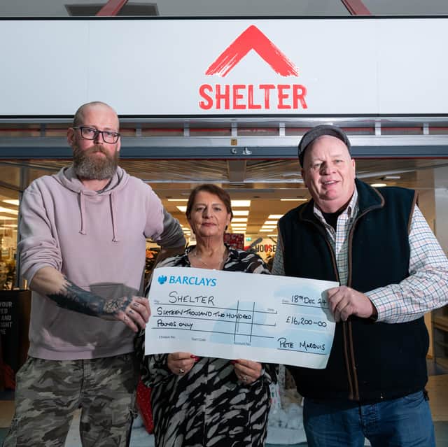 Michael Hackett, Assistant manager Lisa Lane, Manager at Shelter with a cheque presented to them by Pete Marquis.