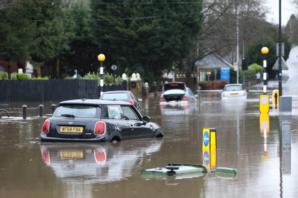Cars stranded in deep water due to flooding in Stockport.