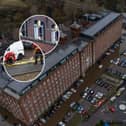 Car are flooded outside a newly converted Meadow Mill on Water street in Stockport as emergency teams arrive to rescue people trapped inside. January 1 2025.