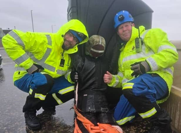 HM Fleetwood Coastguards with the 'casualty' rescued from the sea. Photo: HM Coastguard