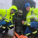 HM Fleetwood Coastguards with the 'casualty' rescued from the sea. Photo: HM Coastguard