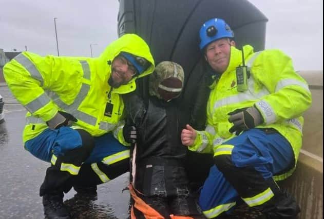 HM Fleetwood Coastguards with the 'casualty' rescued from the sea. Photo: HM Coastguard
