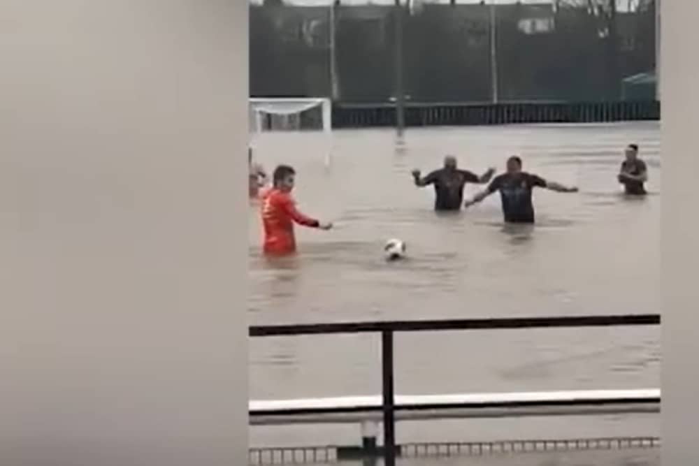 Lydney Town AFC players swim in flooded pitch
