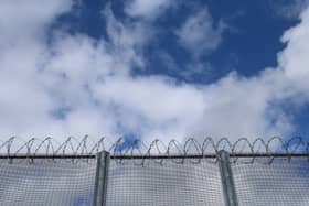 Drones dropping drugs and weapons to dangerous prisoners being held in high-security jails are a "threat to national security", a watchdog has warned