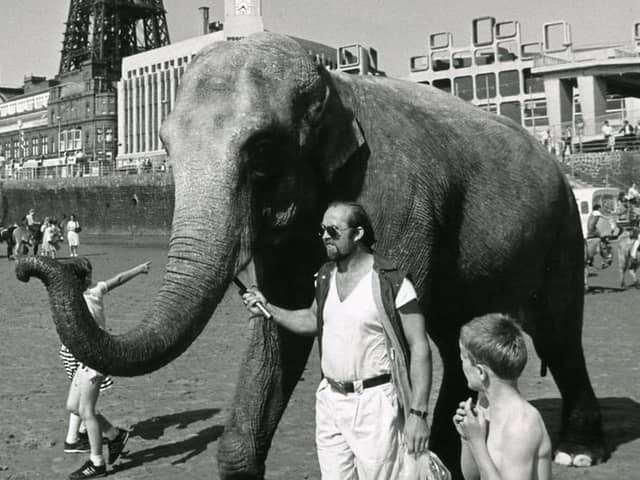 Layla a Tower Circus Elephant with her trainer on Blackpool Beach in 1984