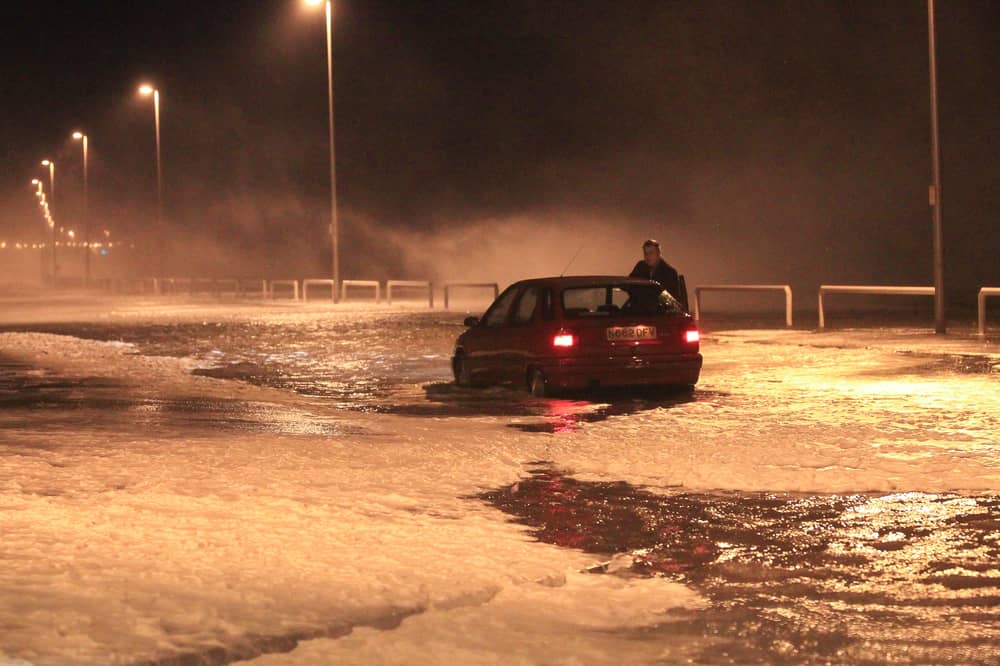 Picture shows a member of the public getting as closer look at the turbulent sea front but got stuck in the process