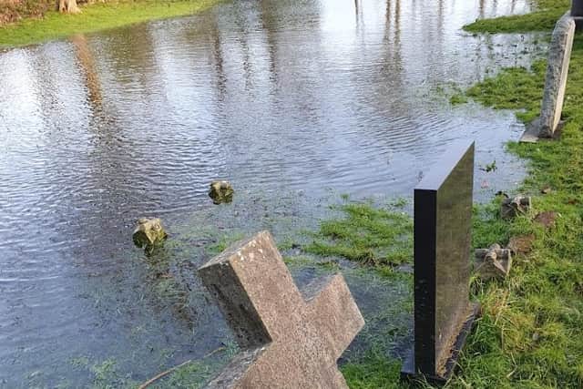 Part of Layton Cemetery is badly flooded and resembles a lake, says a resident