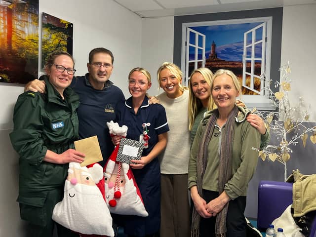Ian with family and medics