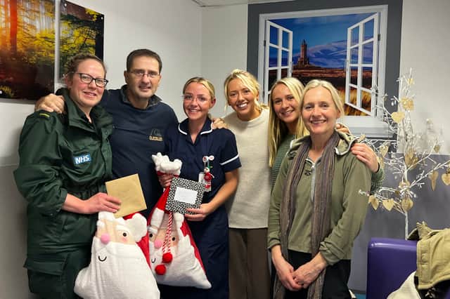 Ian with family and medics