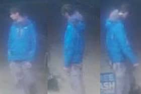 A man is wanted by police following a robbery at a cash machine in Blackpool