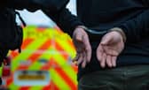 He was arrested by police officers.