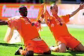 Jason Euell, left, celebrates Blackpool's promotion to the Premier League with Charlie Adam