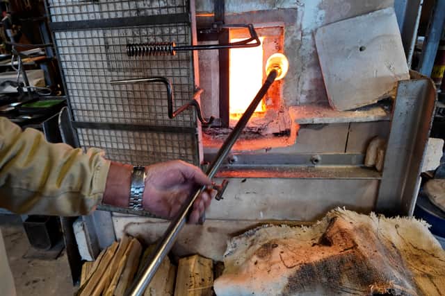 John Ditchfield, works at his furnace which is 'never switched off'. 