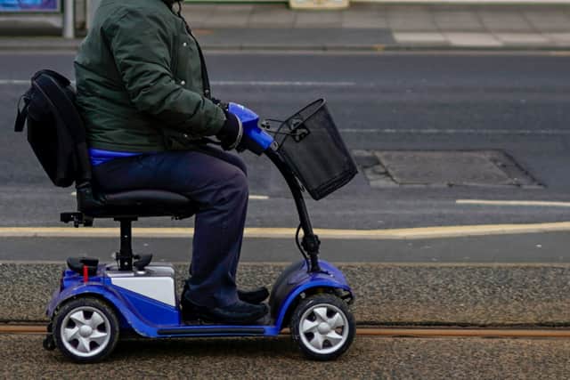 A 6ft 7in man on a mobility scooter smelled strongly of cannabis when police stopped him for driving erratically