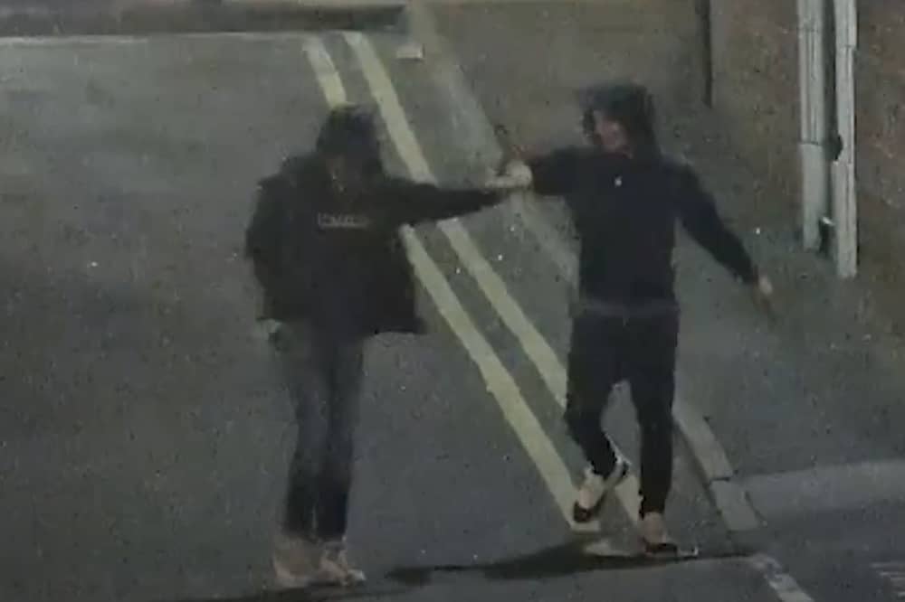 Ramaray Treasure and Leon Sykes fist bump moments after raining blows on a man with West Street with knives in hand.