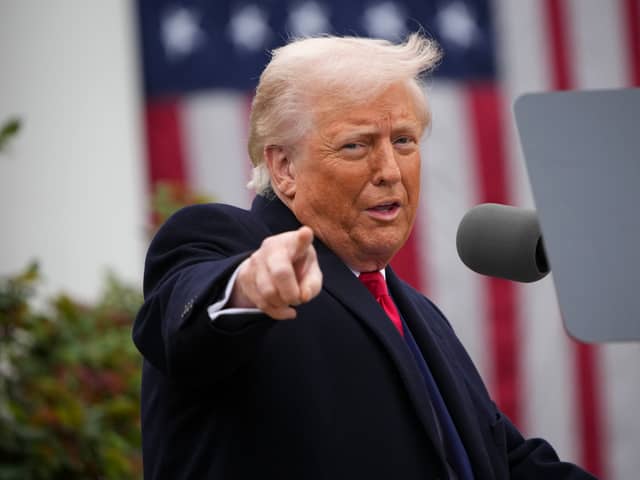 US President Donald Trump gestures as he unveils his tariffs policy at the White House