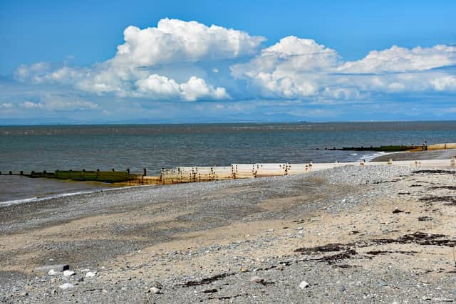 A woman in her 60s has died and a man remains in a critical condition in hospital after the pair entered the sea at Cleveleys in an attempt to rescue their dog.
