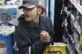 Officers want to speak to this woman in connection with a robbery at a store in Blackpool
