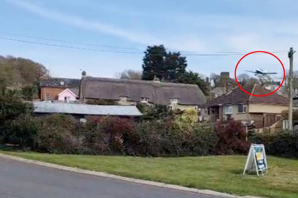 A dramatic video captures the moment a plane came in low and hit a chimney before crashing at an Isle of Wight holiday park.