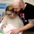 Shannon Lord, 27, and Dayle Newton, 36, with baby Ayla shortly before her tragic death. "We had to make the decision to withdraw her care as a result of severe brain damage. We sat with our girl in our arms for eleven hours watching her slowly die."