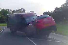 Minibus smashes head-on into car - seriously injuring three.