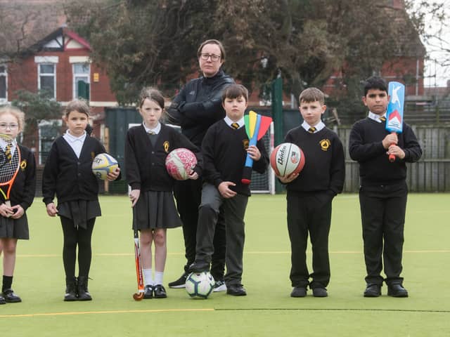 Pupils from Chaucer Primary in Fleetwood are fundraising for new astro turf which has become unsafe to use.  Pictured are pupils Monroe Hadgraft, Marta Kitova, Thea Moran, Bobby Broadhurst, Troy Crompton and Mohammad Al Mhiemid with PE coordinator Leanne Soper.