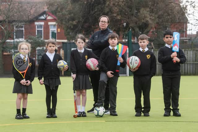 Pupils from Chaucer Primary in Fleetwood are fundraising for new astro turf which has become unsafe to use.  Pictured are pupils Monroe Hadgraft, Marta Kitova, Thea Moran, Bobby Broadhurst, Troy Crompton and Mohammad Al Mhiemid with PE coordinator Leanne Soper.