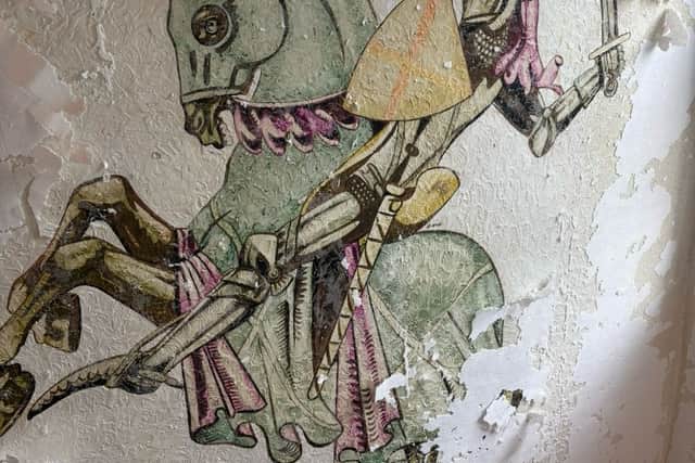 Hand-painted mural along the staircase