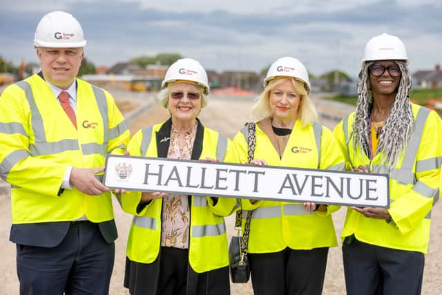 Pauline and Jacqueline Hallett hold the 'Hallett Avenue' sign honouring Blackpool's aviation legacy and their father Austin Hallett's wartime contributions