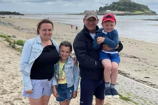 Jason Dullaghan  with his wife, Alison, and children, Emily and George
