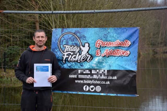 Jason Dullaghan's son, Danny, outside fishing competion held in his father's honour