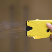 A Taser was fired during the street fight - but that didn't stop the officer intervening