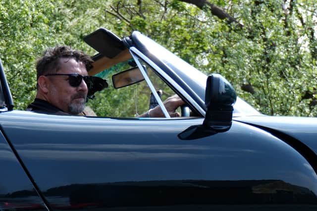 Mark Blackwell, chair of TVR Car Club Lancashire, drives his Griffith outside the Cross Keys Inn, Whitechapel
