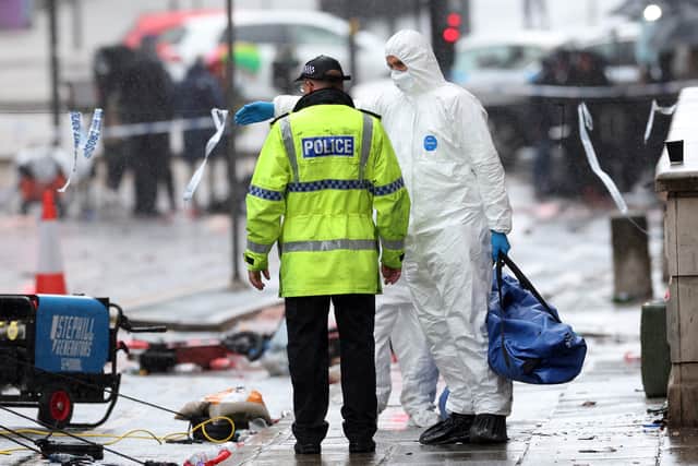 Crime Scene Investigators at the scene of the Liverpool FC parade incident on Water Street on May 27, 2025 in Liverpool.