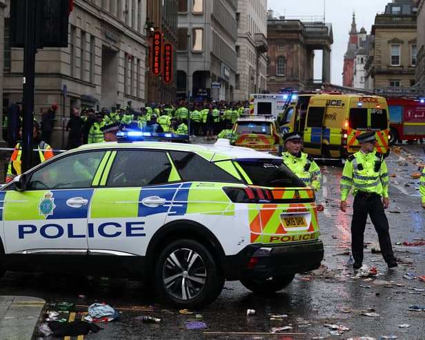 Police officers stand on duty at a cordon at the entrance to Water Street on May 26.
