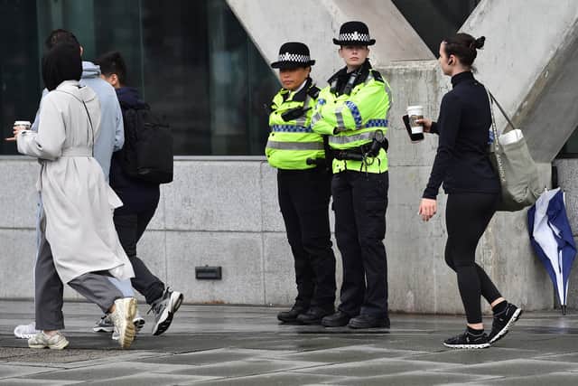Police officers stand guard outside Liverpool Magistrates' Court in Liverpool.