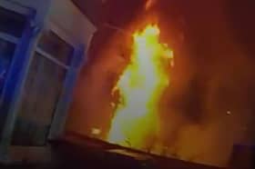 Dramatic moment massive house fire rages as police race to evacuate street.