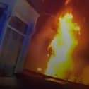 Dramatic moment massive house fire rages as police race to evacuate street.