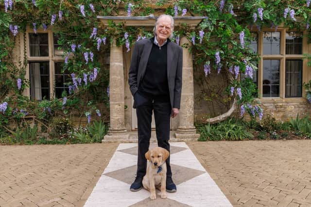 David Bradley, Guide Dogs Ambassador with trainee guide dog Viola at the latest Omaze Million Pound House Draw in Cotswolds.