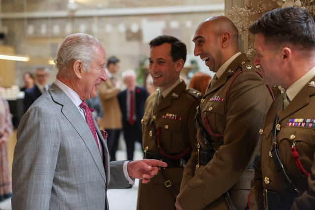 King Charles III talks with members of the military as he joins a reception celebrating Lancashire and its communities during his visit to Lancaster Castle
