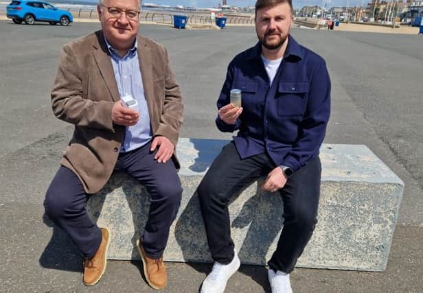 Chris Webb (right) and Colin Dente with water samples taken from the sea at South Shore
