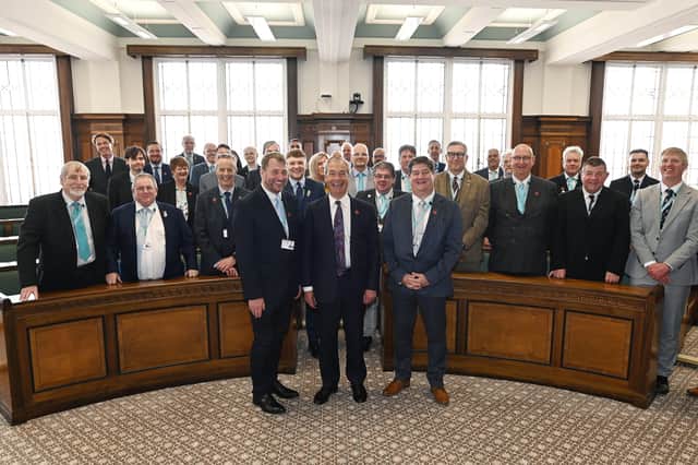 Reform UK leader Nigel Farage [front, centre], pictured with the party's new administration in control of Lancashire County Council