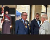 Alf Clempson  as a member of the Scots Guards (left) and meeting King Charles III in Lancaster earlier this month