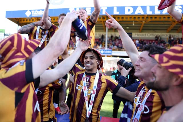Brandon Khela celebrates promotion with his Bradford team-mates at the end of last season