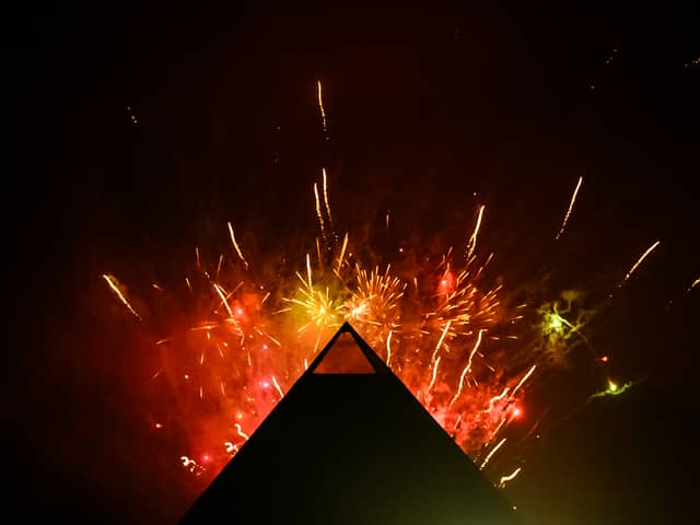 Fireworks explode in the sky above the Pyramid Stage at Glastonbury Festival