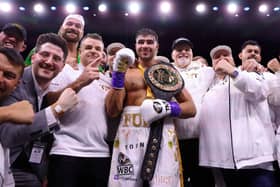 Tommy Fury celebrates with his coachign team after defeating Jake Paul in 2023. Brother Tyson Fury and father John Fury are also pictured.