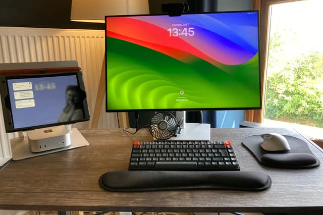 Blink and you'll miss it: my Mac Mini nestled under my iPad on the left of my office setup