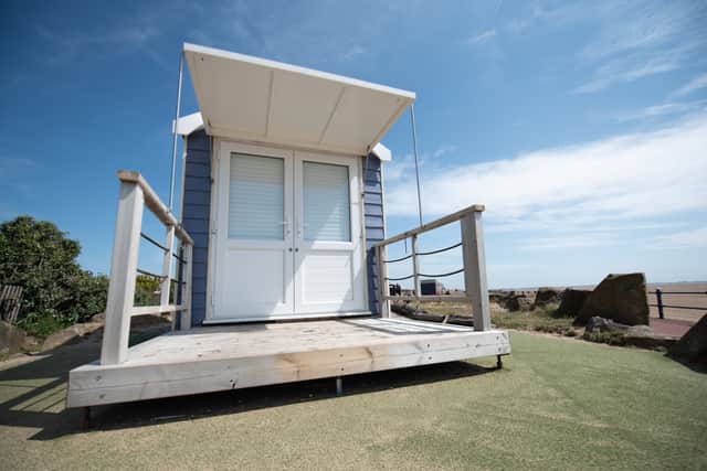 Exterior of the 'show' beach hut on St Annes promenade, on a sunny day. Photo credit: Lucinda Herbert